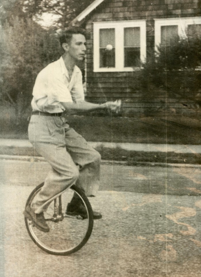 A young Claude Shannon riding a unicycle
